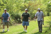 Saccomanno, Ahern, and McCarroll check a trail