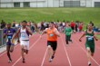 Kevin Merrigan battles for 1st in the 100m Dash